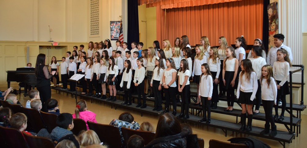 The Bayville Intermediate School chorus performs for Bayville Primary School students on Dec. 12.