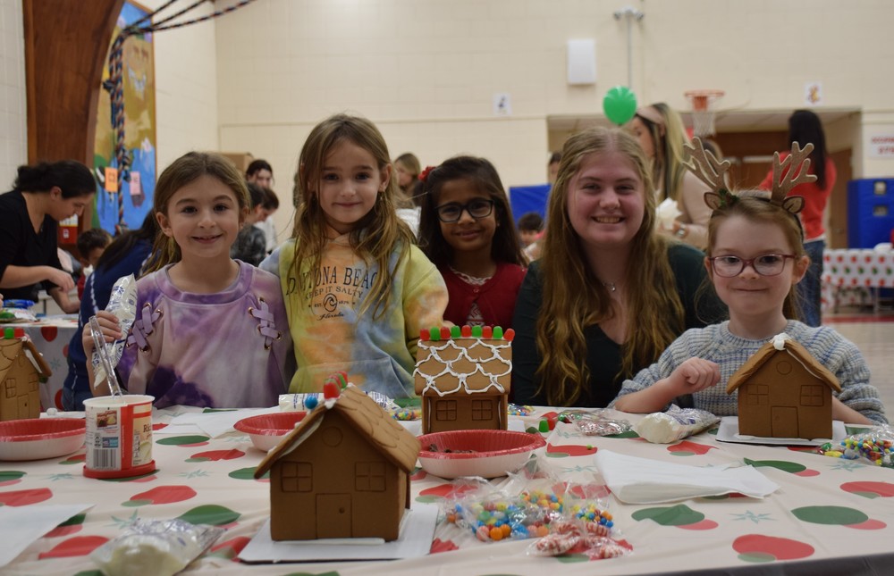 AMP students work on their gingerbread houses.