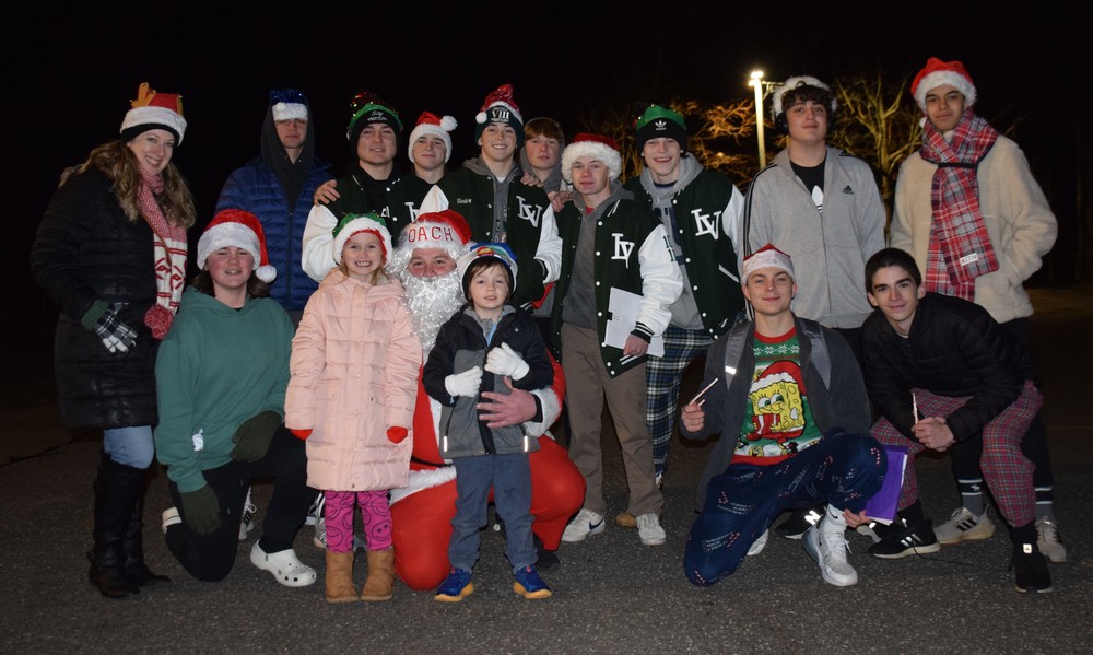 Members of the LVHS varsity wrestling team caroled for a cause on Dec. 21.