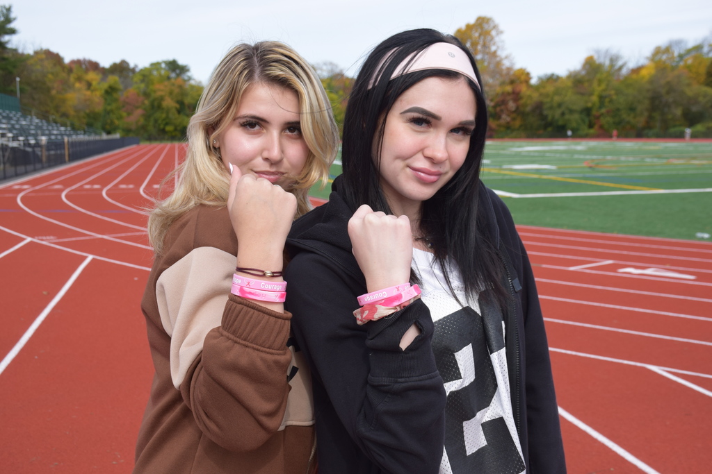 Students purchased pink bracelets for breast cancer awareness.