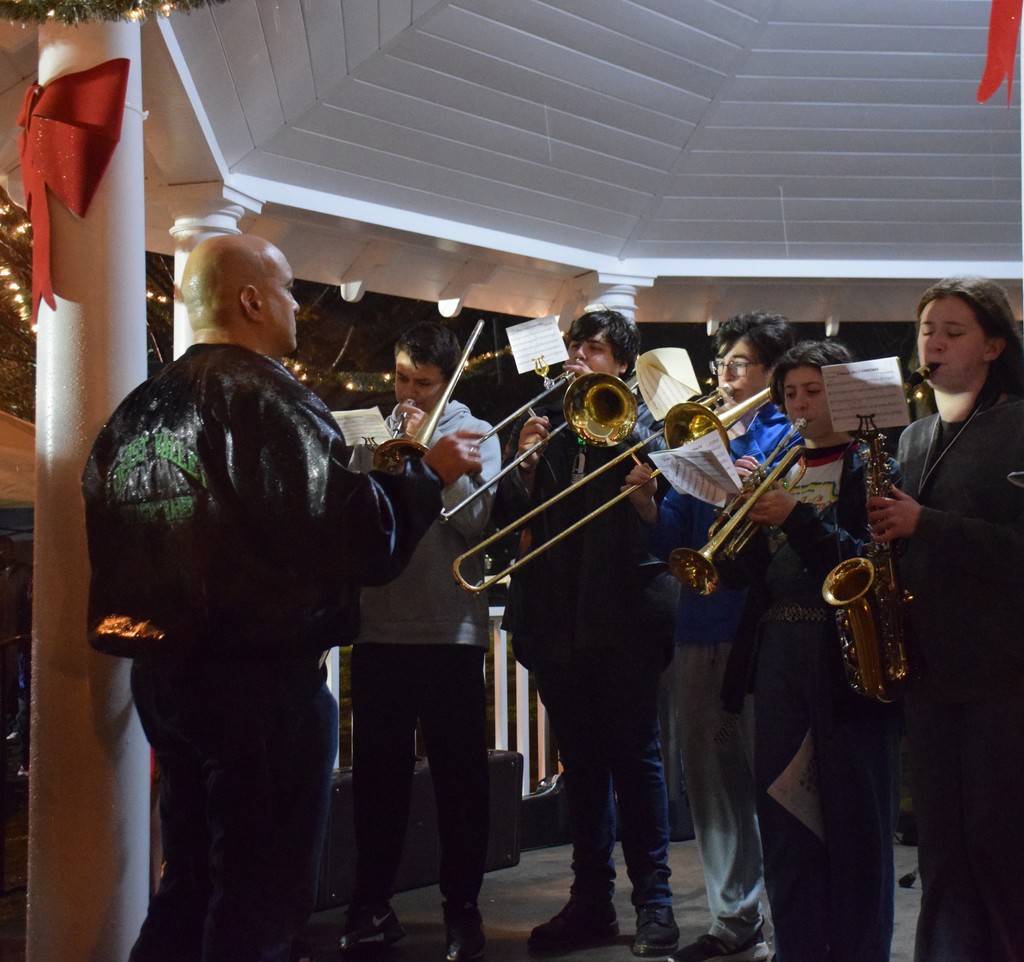 The LVHS stage band performs through the rain in Locust Valley on Dec. 6.