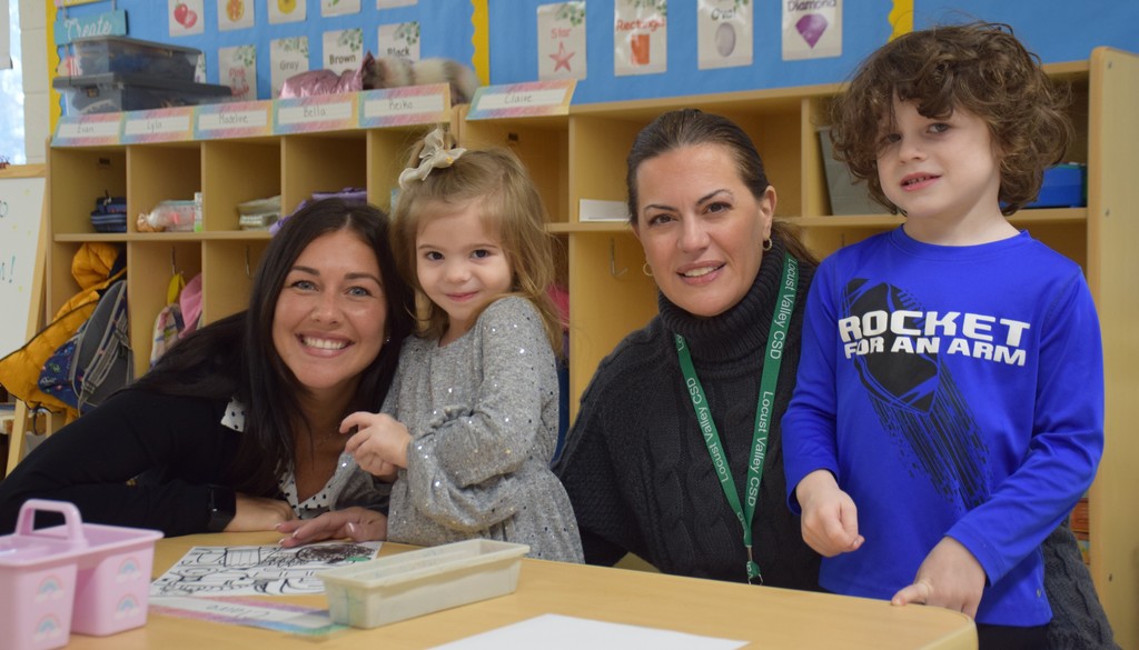 Bayville Primary School teachers Christine Cornella and Janice Miraglia greet new pre-K students.