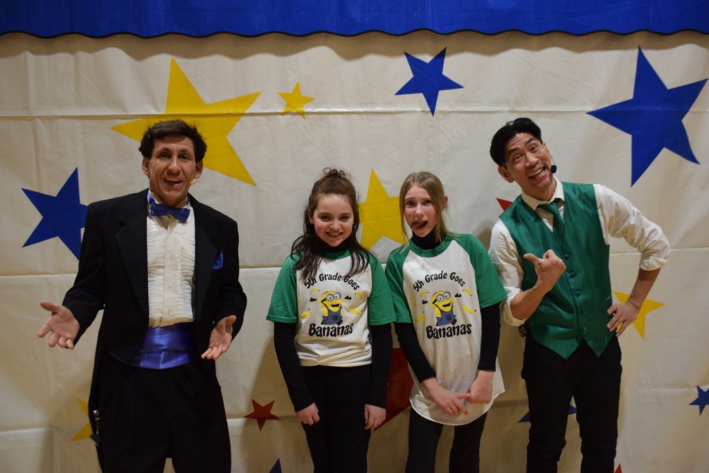 Bayville Intermediate School fifth-graders Elisa Valle and Sara Furthner, center left and right, with circus performers Andrew Scharff and Rob Lok, outside left and right.