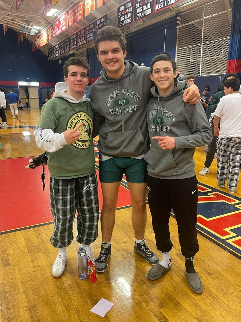 County champions Charlie Dickman, C.J. Kelly and Evan Shriberg celebrate their titles.