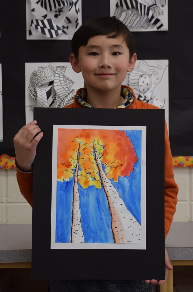 Fifth grade Bayville Intermediate School student Haichen Cotten pictured with his watercolor painting that was selected for the Colors of Long Island Student Art Show.
