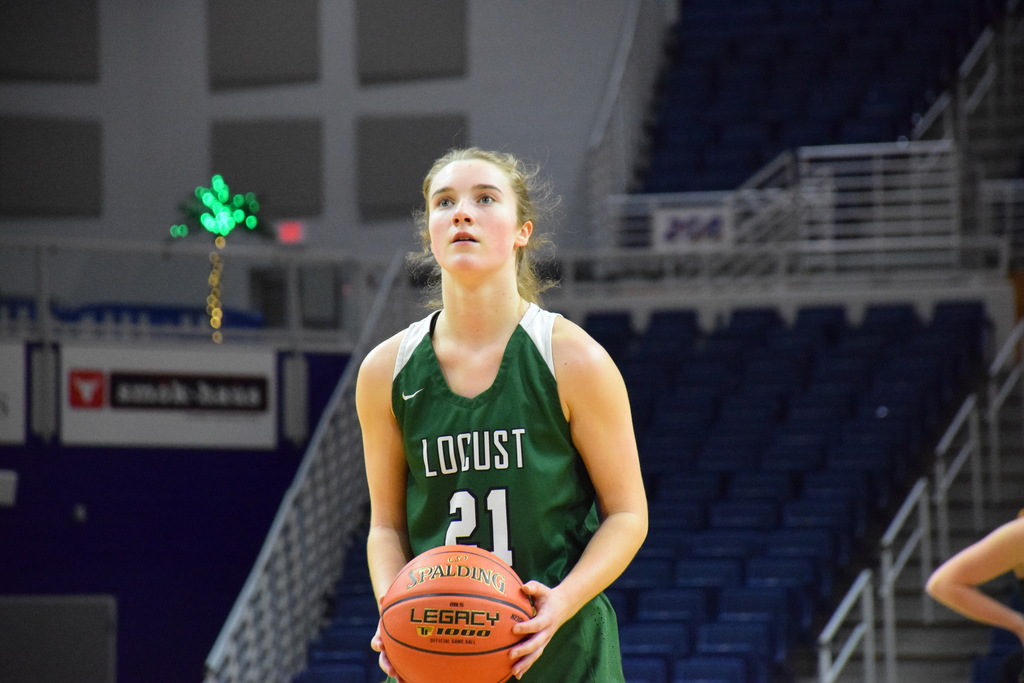 Payton Tini helps put the game away with foul shots during her 14-point fourth quarter.