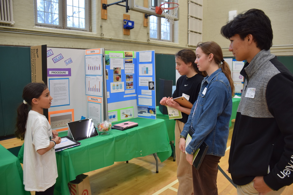 Judges from Locust Valley High School came to discuss students’ projects with them.