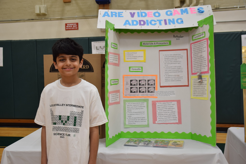 Fifth-grade Locust Valley Intermediate student Aasher Gill with his first-place project on the addictiveness of video games.