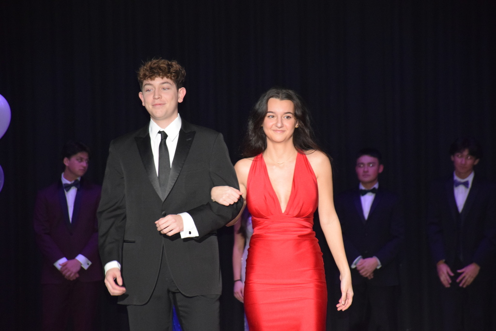 Gerardo Salinas and Alessandra DiMaggio strut on the stage at the LVHS auditorium.