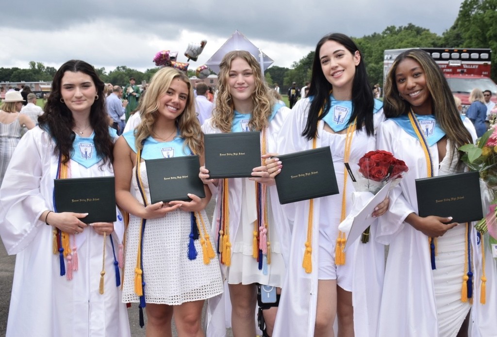 Locust Valley High School Class of 2023 graduating seniors celebrate on Fred Smith Field after the ceremony on June 24.