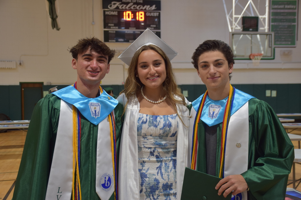 Graduating seniors Matthew Sarubbe, Lauren Caiazzo and Nicholas Sarubbe get ready for graduation in the school gym before the ceremony.