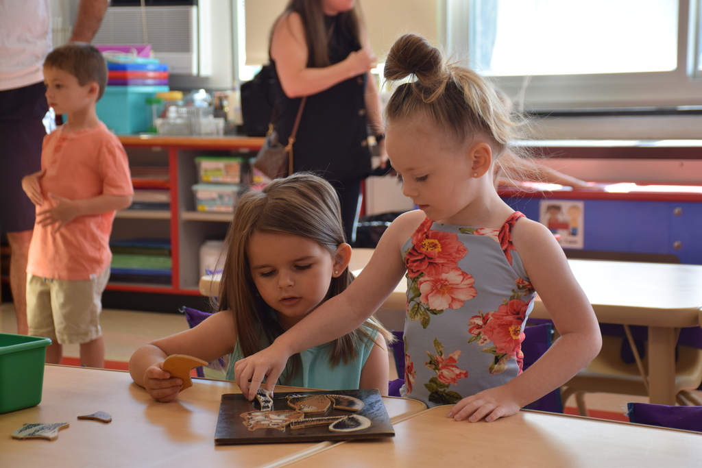 Two new prekindergarten students at Ann MacArthur Primary become fast friends during orientation on Aug. 31.
