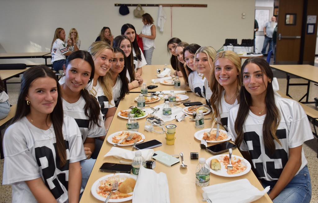 Locust Valley High School cheerleaders at the team dinner prior to the jersey signing ceremony.